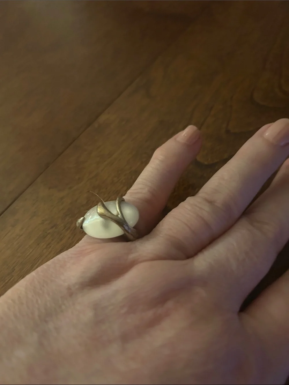 Elegant White Stone Ring with Gold-Tone Vine Setting